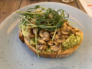 Bread with avocado and mushrooms at The Urban Garden in Vilnius