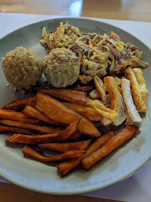 Peanut lentil dumplings with coleslaw and amazing sweet potato fries at Vegehop in Zagreb