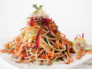 Raw colorful spaghetti with dried tomato sauce at Vegehop in Zagreb