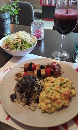 Daily menu: "french" salad, tofu and seitan on sticks and brown rice with black sesame sauce, natural grape juice #Veganuary at Vegehop in Zagreb