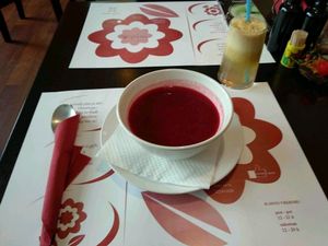 Beet soup and apple juice at Vegehop at Vegehop in Zagreb
