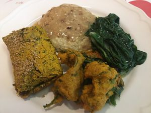 Daily menu - steamed greens, millet with hazelnut sauce, tempura, and crepe  at Vegehop in Zagreb