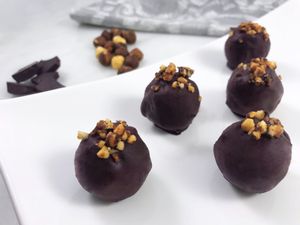 A delicious center of roasted hazelnuts, covered in a decadent dark chocolate shell and topped with caramelized toasted hazelnuts. These delectable truffles are a delight you must try.

If you are looking for a treat that helps you stay in shape and operating at your best, then look no further because these treats are completely raw, vegan, paleo, keto, non-gmo, gluten-free and sugar-free... just simply good for you!
 at Heidis Feel Good Foods in Clearwater