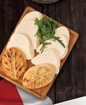 Cheese platter with mchadi. Homemade suluguni, homemade imeruli and 2pcs mchadi - corn tortilla. at Gruzie in Prague