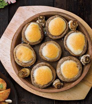 Mushrooms with cheese, baked in a traditional clay pot (Ketsi). at Gruzie in Prague