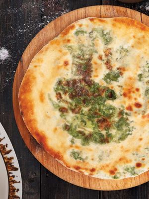 Mkhlovani - round bread filled with cheese and spinach. at Gruzie in Prague