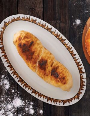 Khachapuri prepared on the grill stuffed with Imereti cheese. at Gruzie in Prague