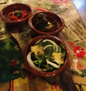 Vegan antipasti: Bell Pepper with salsa (top), grilled broccoli with garlic (middle), salad with fennel, raisins and orange (bottom) at Mamma Peppino in Alkmaar
