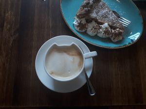 Soy coffee and apple pie at Crazy Cat Café in Milan