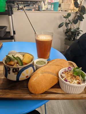 Vegan stew and ice peach tea at Rustle & Still in Toronto