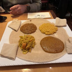 veggie combo w split red lentils, split yellow peas, cabbage, and chickpea stew   at Zoma Ethiopian in Cleveland