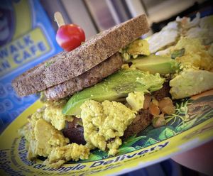 Pesto, avocado, eggwich ! 💥 and sweet potato fries!   at Leo's Superfood Vegan Cafe in Northridge