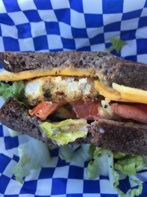 a couple bites into my McLeo's Tofu Egg Muffin at Leo's Superfood Vegan Cafe in Northridge