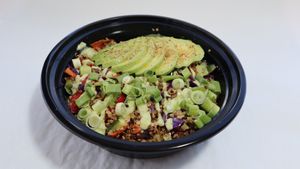 Quinoa Power Bowl: Quinoa, roasted peppers, zuchinni, red cabbage and carrots topped with "ground beef", scallions, cilantro with cashew lime crema and avacado. at Leo's Superfood Vegan Cafe in Northridge