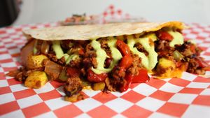 Breakfast Quesadilla: Zuchinni, onions, peppers and "chorizo" spiced sausage, in a folded gluten free Tortilla with melted mozzarella, topped with cilantro lime crema and pico. at Leo's Superfood Vegan Cafe in Northridge