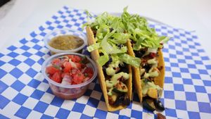 Soft or Crunchy Tacos: Roasted zucchini, roasted peppers, black beans, jalepenos, topped with romaine lettuce, salsa verde and cashew lime crema. at Leo's Superfood Vegan Cafe in Northridge