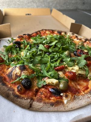 No. 9. Tomato, vegan mozzarella, sun-dried cherry tomatoes, atichokes, olives & rocket £11.95  at Hangin' Pizzeria in Betws-y-coed