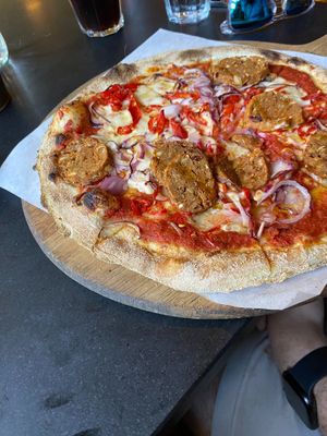 Tomato, vegan mozzarella, fresh chillies, red onions & Pizzarami vegan sausage pizza at Hangin' Pizzeria in Betws-y-coed