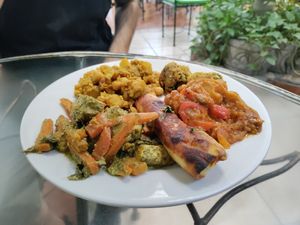 Buffet selection of the day: Tofu stir-fry, chickpea potato curry, falafel, flauta, and Spanish-style eggplant at Rey Sol in Guatemala City