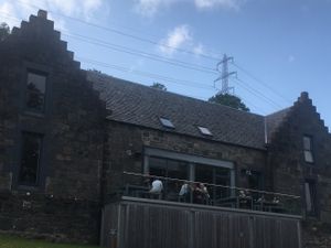 Gorgeous exterior with large patio space. at Ben Cruachan Inn in Dalmally