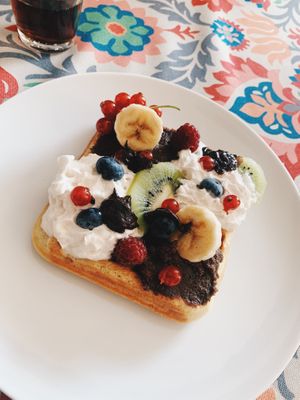 Waffles with vegan whipped cream and fruits. at Vege Express in Gliwice