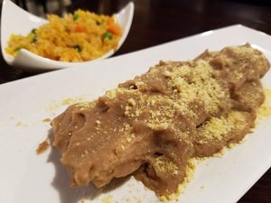 Enfrijoladas with Mexican red rice at Madre Tierra in Upland