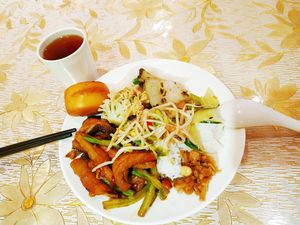 Eggplants, different kind tofu, long beans, cauliflowers, Soy sprouts, pickles, rice, cake, tea. All for 18 ¥ at Good Vegetarian in Shenzhen