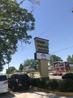 Exterior sign at Green Papaya in Fort Smith