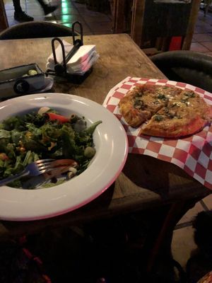 Vegan pizza and salad at Mezzaluna in Loreto