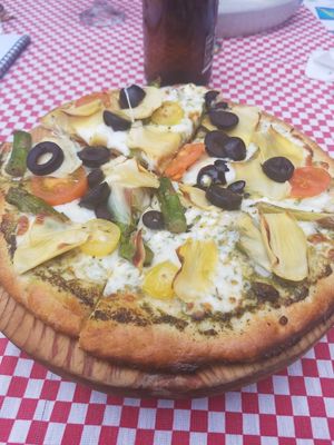 Red sauce, artichoke, black olive, asparagus, cherry tomato pizza at Mezzaluna in Loreto
