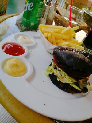 Vegan burger with a black bun (fun!), vegan mayo and all at Koulchi Zine in Marrakech
