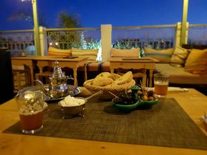 Mint tea and complimentary olives and bread at Koulchi Zine in Marrakech