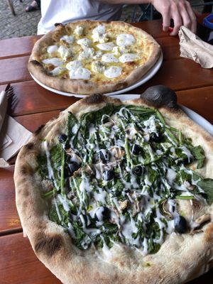 veggie lemon and mozzarella pizza and then bottom is the vegan spinach pizza with pesto base  at Sotto in Berlin