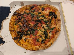 Napoli in one half of a takeaway box at Sotto in Berlin