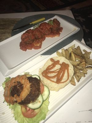 Italian Meatballs and Burger. Burger was yummy but a little bland. Italian meatballs were good too accept they serve them on top of bread which goes extremely soggy.  at White Banana Beach Club in Siargao