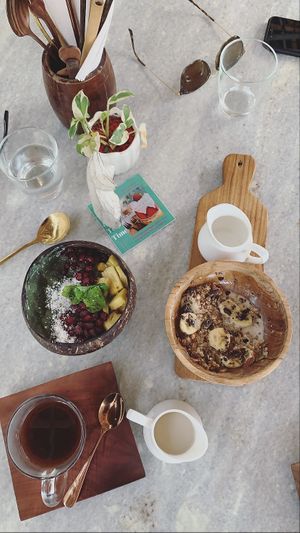 Green goddess bowl, chakra wheel and coffee with soy milk at Loving Earth Cafe in Fort Kochi