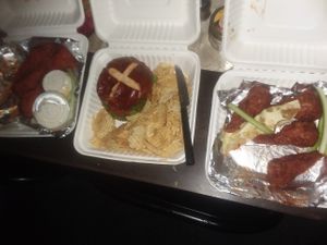 Vegan chicken wings, beyond meat burger on pretzel bun and chips at Strong Hearts in Syracuse