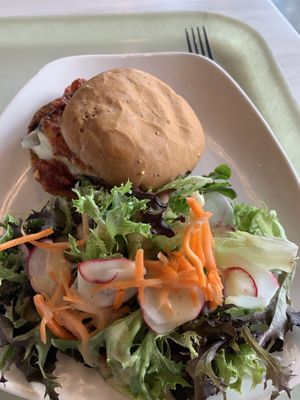 Eggplant parm on a gluten-free roll & side of greens   at Strong Hearts in Syracuse