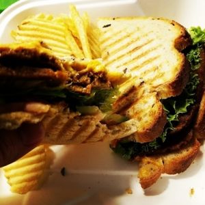 Cajun seitan sandwich with chips  at Strong Hearts in Syracuse