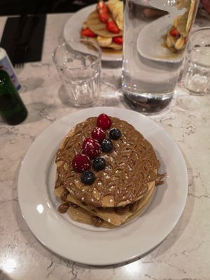 Vegan pancakes with raspberry, blueberry and almond butter at POG - Tara St in Dublin