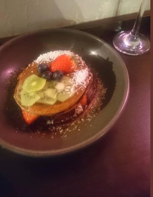 Vegan pancakes with berries, kiwi, coconut and maple syrup at POG - Tara St in Dublin