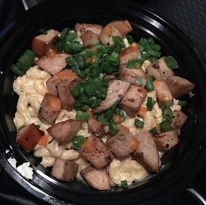 Vegan Mac N Cheese with Vegan Pork added scallions as a garnish.  at Mac n' Cheese Rebel in Los Angeles