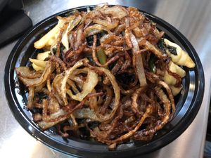 Cheese fries with kale and fried onions at Mac n' Cheese Rebel in Los Angeles