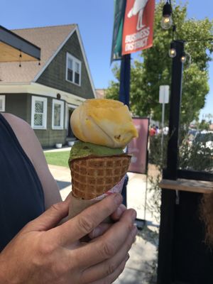 The mango sticky rice and matcha pistachio in a vegan gluten-free waffle cone.  at Stella Jean's in San Diego