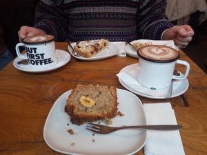 Hot chocolate with oat milk, vegan cherry crumble, vegan  apple crumble, vegan banana bread at Café Fred in Wurzburg
