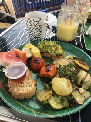 Vegan Breakfast - fried potatoes, avo on toast, kithul (palm syrup) on toast, tomatoes and fruit at The Container Beach Restaurant in Negombo