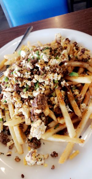 Plant-Based Poutine
Fries smothered in green chili cream gravy. Topped with scrambled tofu, vegan cheese, jalapenos, green onions, and plant-based chorizo. at Sunnyside Diner - NW 6th St in Oklahoma City