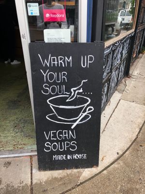 Sign for cafe at The Organic Press in Toronto