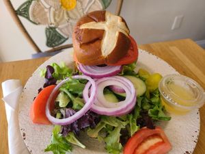 Chick buffalo sandwich with side salad at Veg Eats Foods  in Delray Beach