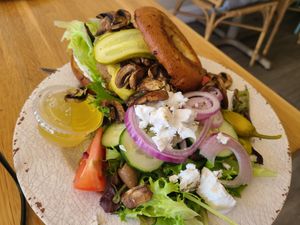 Mushroom burger with side greek salad at Veg Eats Foods  in Delray Beach